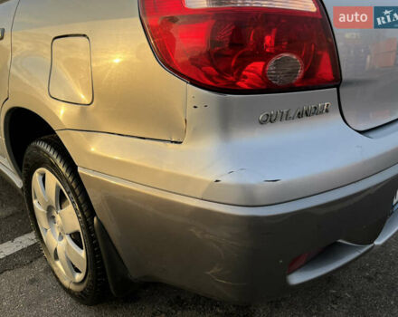 Серый Мицубиси Аутлендер, объемом двигателя 2 л и пробегом 138 тыс. км за 7000 $, фото 10 на Automoto.ua