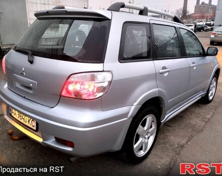 Серый Мицубиси Аутлендер, объемом двигателя 2 л и пробегом 198 тыс. км за 7700 $, фото 3 на Automoto.ua
