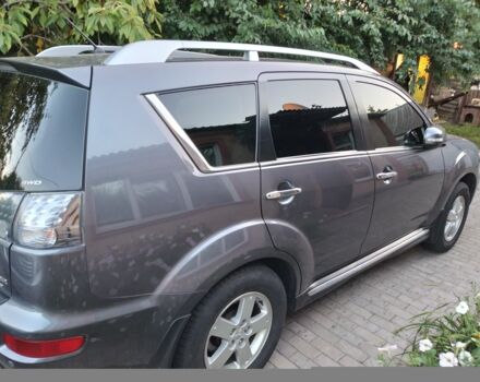 Серый Мицубиси Аутлендер, объемом двигателя 2.4 л и пробегом 151 тыс. км за 11100 $, фото 1 на Automoto.ua