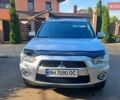 Серый Мицубиси Аутлендер, объемом двигателя 2.36 л и пробегом 185 тыс. км за 9700 $, фото 1 на Automoto.ua