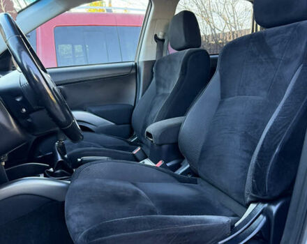 Серый Мицубиси Аутлендер, объемом двигателя 2.4 л и пробегом 218 тыс. км за 9950 $, фото 2 на Automoto.ua