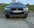 Серый Мицубиси Аутлендер, объемом двигателя 2.18 л и пробегом 221 тыс. км за 9700 $, фото 1 на Automoto.ua