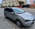 Серый Мицубиси Аутлендер, объемом двигателя 2.36 л и пробегом 205 тыс. км за 9250 $, фото 1 на Automoto.ua
