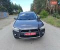 Серый Мицубиси Аутлендер, объемом двигателя 2.4 л и пробегом 220 тыс. км за 11800 $, фото 1 на Automoto.ua