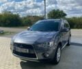 Серый Мицубиси Аутлендер, объемом двигателя 2 л и пробегом 225 тыс. км за 10500 $, фото 1 на Automoto.ua