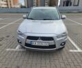 Серый Мицубиси Аутлендер, объемом двигателя 2.2 л и пробегом 175 тыс. км за 10999 $, фото 1 на Automoto.ua