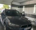 Серый Мицубиси Аутлендер, объемом двигателя 2 л и пробегом 225 тыс. км за 10500 $, фото 1 на Automoto.ua