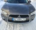 Серый Мицубиси Аутлендер, объемом двигателя 2.18 л и пробегом 220 тыс. км за 11900 $, фото 1 на Automoto.ua