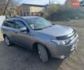 Серый Мицубиси Аутлендер, объемом двигателя 2.27 л и пробегом 240 тыс. км за 12150 $, фото 1 на Automoto.ua