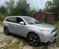 Серый Мицубиси Аутлендер, объемом двигателя 2 л и пробегом 224 тыс. км за 10494 $, фото 1 на Automoto.ua