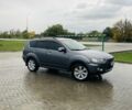 Серый Мицубиси Аутлендер, объемом двигателя 2.4 л и пробегом 260 тыс. км за 9800 $, фото 1 на Automoto.ua