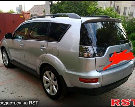 Серый Мицубиси Аутлендер, объемом двигателя 2.4 л и пробегом 145 тыс. км за 11000 $, фото 1 на Automoto.ua