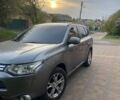 Серый Мицубиси Аутлендер, объемом двигателя 2.4 л и пробегом 122 тыс. км за 12000 $, фото 1 на Automoto.ua