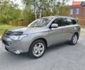 Серый Мицубиси Аутлендер, объемом двигателя 2.2 л и пробегом 242 тыс. км за 12999 $, фото 1 на Automoto.ua