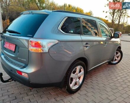 Серый Мицубиси Аутлендер, объемом двигателя 2.3 л и пробегом 250 тыс. км за 13499 $, фото 1 на Automoto.ua