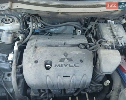 Серый Мицубиси Аутлендер, объемом двигателя 2.4 л и пробегом 197 тыс. км за 14000 $, фото 24 на Automoto.ua