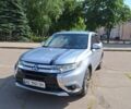 Серый Мицубиси Аутлендер, объемом двигателя 2.4 л и пробегом 160 тыс. км за 14200 $, фото 1 на Automoto.ua