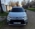 Серый Мицубиси Аутлендер, объемом двигателя 2.4 л и пробегом 200 тыс. км за 12980 $, фото 1 на Automoto.ua
