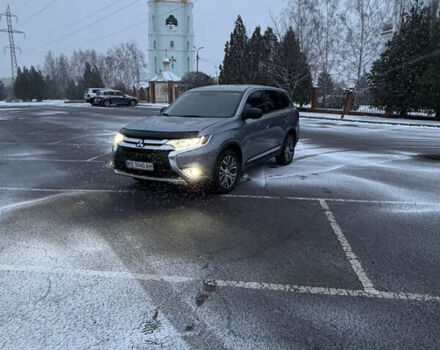 Серый Мицубиси Аутлендер, объемом двигателя 2.36 л и пробегом 205 тыс. км за 13400 $, фото 1 на Automoto.ua