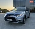 Серый Мицубиси Аутлендер, объемом двигателя 2.4 л и пробегом 153 тыс. км за 12500 $, фото 1 на Automoto.ua