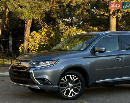 Серый Мицубиси Аутлендер, объемом двигателя 2.4 л и пробегом 167 тыс. км за 15999 $, фото 1 на Automoto.ua