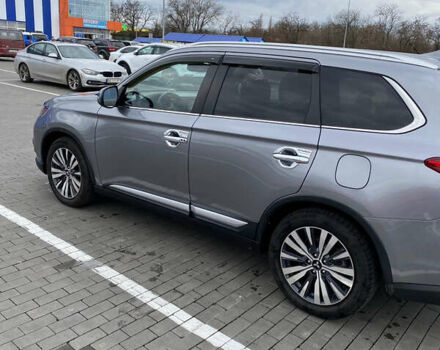 Серый Мицубиси Аутлендер, объемом двигателя 2.36 л и пробегом 160 тыс. км за 18300 $, фото 2 на Automoto.ua