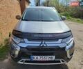 Серый Мицубиси Аутлендер, объемом двигателя 2.36 л и пробегом 125 тыс. км за 15500 $, фото 2 на Automoto.ua