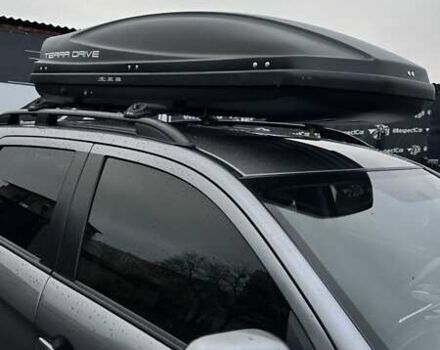 Серый Мицубиси Аутлендер, объемом двигателя 2 л и пробегом 70 тыс. км за 16899 $, фото 1 на Automoto.ua