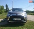Серый Мицубиси Аутлендер, объемом двигателя 2 л и пробегом 93 тыс. км за 19300 $, фото 1 на Automoto.ua