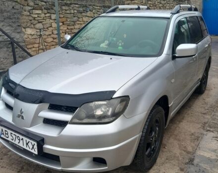 Серый Мицубиси Аутлендер, объемом двигателя 2.4 л и пробегом 250 тыс. км за 5600 $, фото 1 на Automoto.ua