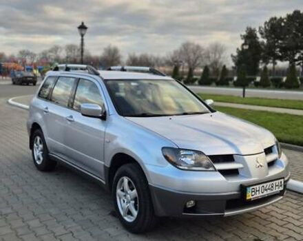 Серый Мицубиси Аутлендер, объемом двигателя 2 л и пробегом 209 тыс. км за 5800 $, фото 1 на Automoto.ua