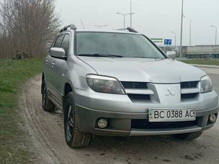 Серый Мицубиси Аутлендер, объемом двигателя 2 л и пробегом 412 тыс. км за 4800 $, фото 1 на Automoto.ua