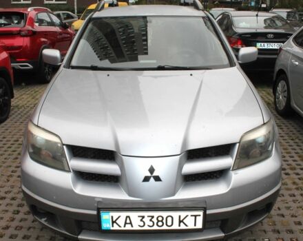 Серый Мицубиси Аутлендер, объемом двигателя 2.4 л и пробегом 255 тыс. км за 5299 $, фото 1 на Automoto.ua