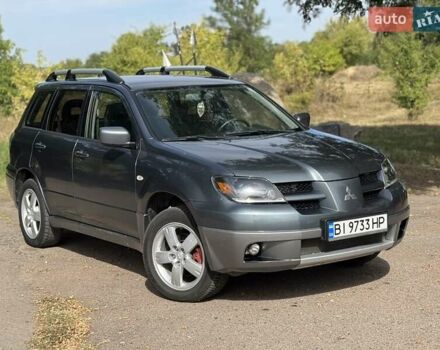 Сірий Міцубісі Аутлендер, об'ємом двигуна 2.4 л та пробігом 276 тис. км за 6299 $, фото 1 на Automoto.ua