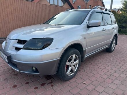 Серый Мицубиси Аутлендер, объемом двигателя 2.4 л и пробегом 221 тыс. км за 5550 $, фото 1 на Automoto.ua