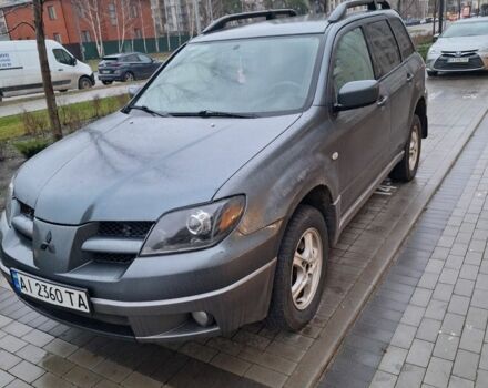 Серый Мицубиси Аутлендер, объемом двигателя 2.4 л и пробегом 286 тыс. км за 4800 $, фото 1 на Automoto.ua