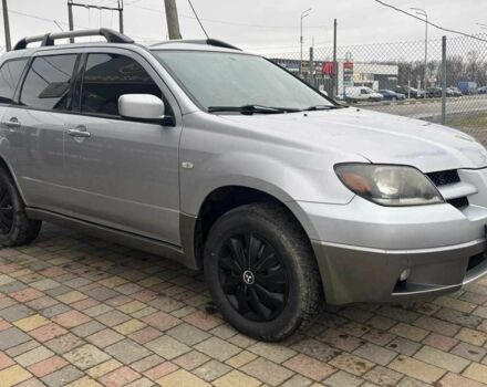 Серый Мицубиси Аутлендер, объемом двигателя 2.4 л и пробегом 256 тыс. км за 6700 $, фото 1 на Automoto.ua