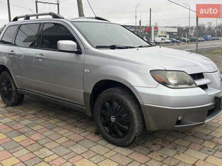 Серый Мицубиси Аутлендер, объемом двигателя 2.38 л и пробегом 256 тыс. км за 6700 $, фото 1 на Automoto.ua