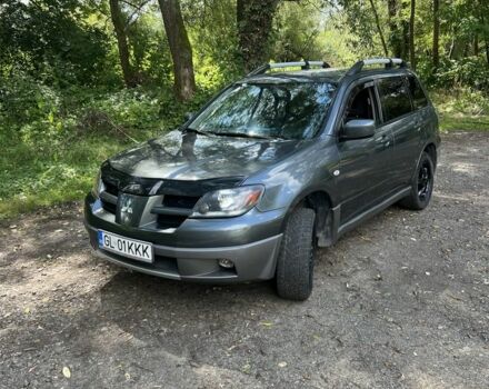 Серый Мицубиси Аутлендер, объемом двигателя 2 л и пробегом 240 тыс. км за 2500 $, фото 1 на Automoto.ua
