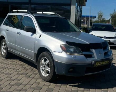 Серый Мицубиси Аутлендер, объемом двигателя 2.4 л и пробегом 240 тыс. км за 5700 $, фото 1 на Automoto.ua