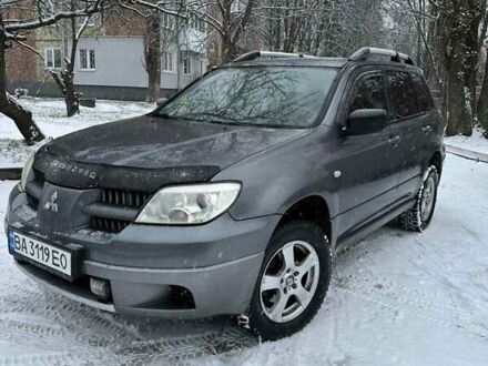 Серый Мицубиси Аутлендер, объемом двигателя 2 л и пробегом 390 тыс. км за 4800 $, фото 1 на Automoto.ua