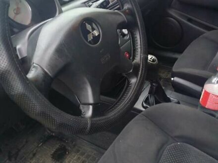 Серый Мицубиси Аутлендер, объемом двигателя 2 л и пробегом 387 тыс. км за 4100 $, фото 1 на Automoto.ua