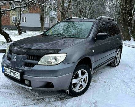 Серый Мицубиси Аутлендер, объемом двигателя 2 л и пробегом 390 тыс. км за 5400 $, фото 1 на Automoto.ua