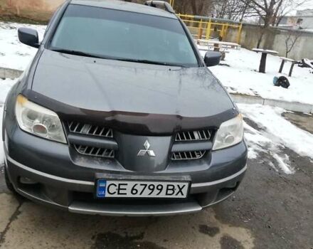 Серый Мицубиси Аутлендер, объемом двигателя 2 л и пробегом 153 тыс. км за 6400 $, фото 1 на Automoto.ua