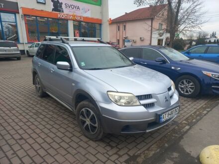 Серый Мицубиси Аутлендер, объемом двигателя 2.4 л и пробегом 246 тыс. км за 5500 $, фото 1 на Automoto.ua