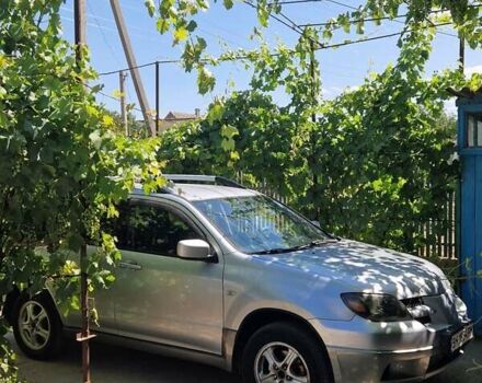 Серый Мицубиси Аутлендер, объемом двигателя 2.38 л и пробегом 260 тыс. км за 4900 $, фото 1 на Automoto.ua