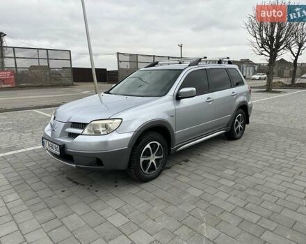 Сірий Міцубісі Аутлендер, об'ємом двигуна 2.38 л та пробігом 246 тис. км за 5500 $, фото 1 на Automoto.ua
