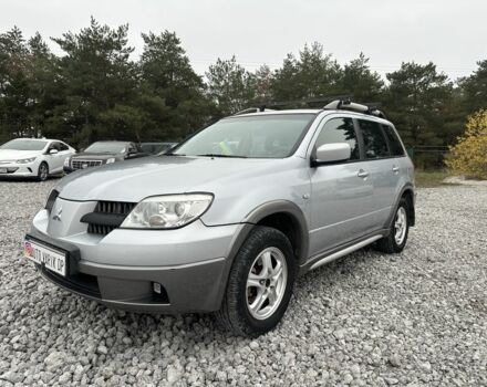 Серый Мицубиси Аутлендер, объемом двигателя 2.4 л и пробегом 260 тыс. км за 5750 $, фото 1 на Automoto.ua