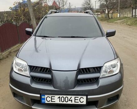 Серый Мицубиси Аутлендер, объемом двигателя 2.4 л и пробегом 230 тыс. км за 5927 $, фото 1 на Automoto.ua