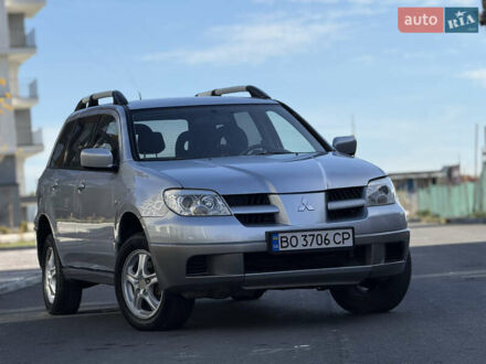 Серый Мицубиси Аутлендер, объемом двигателя 2 л и пробегом 235 тыс. км за 5200 $, фото 1 на Automoto.ua
